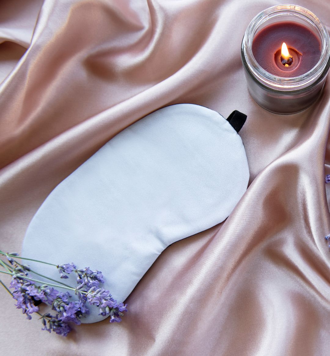 Sleeping mask with lavender and a candle