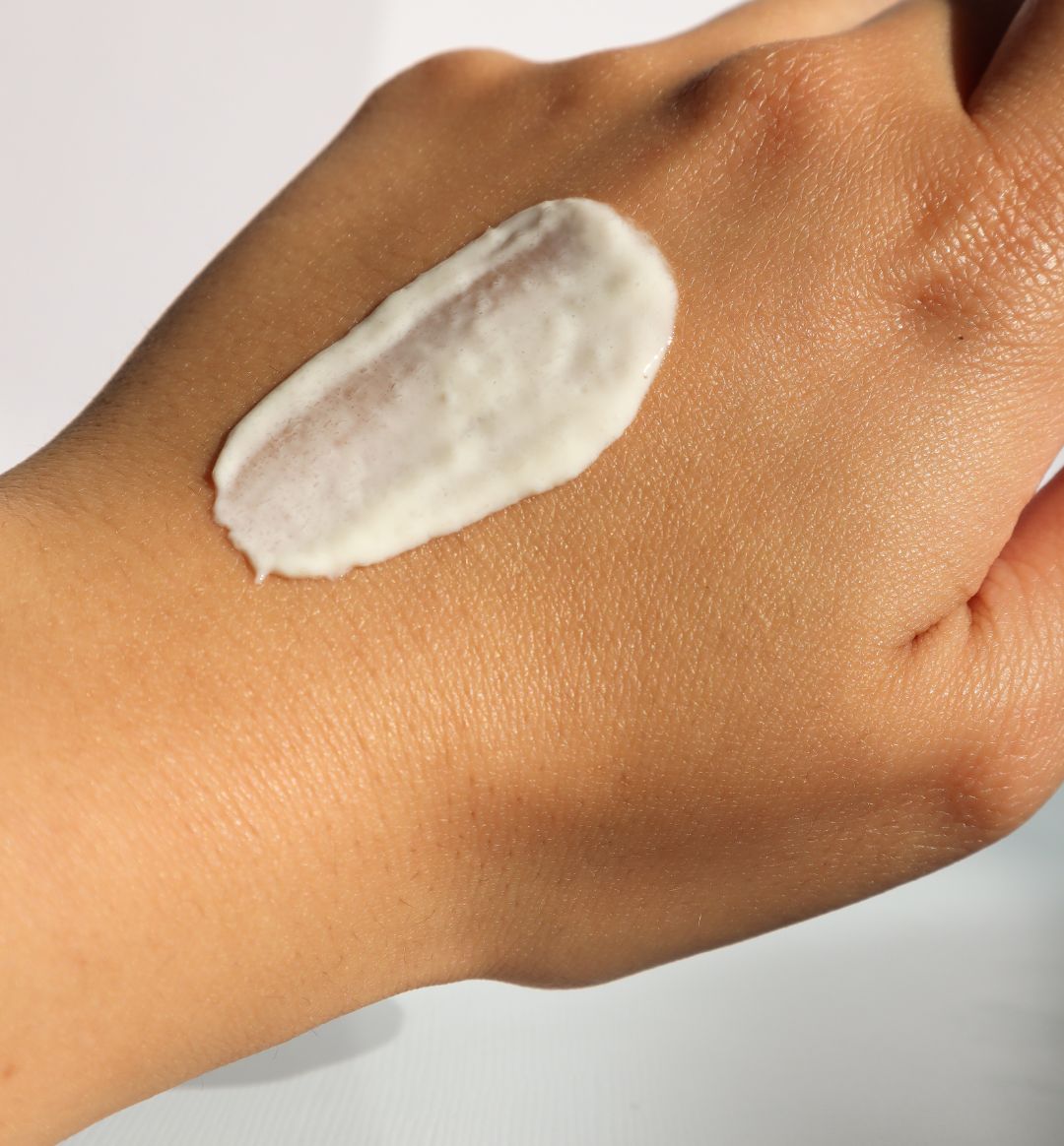 Protective natural sunscreen on woman’s hand