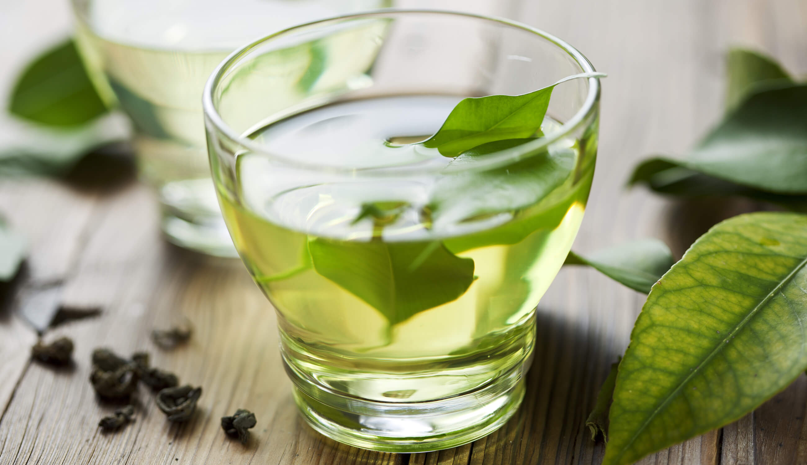 Green tea leaves in cup