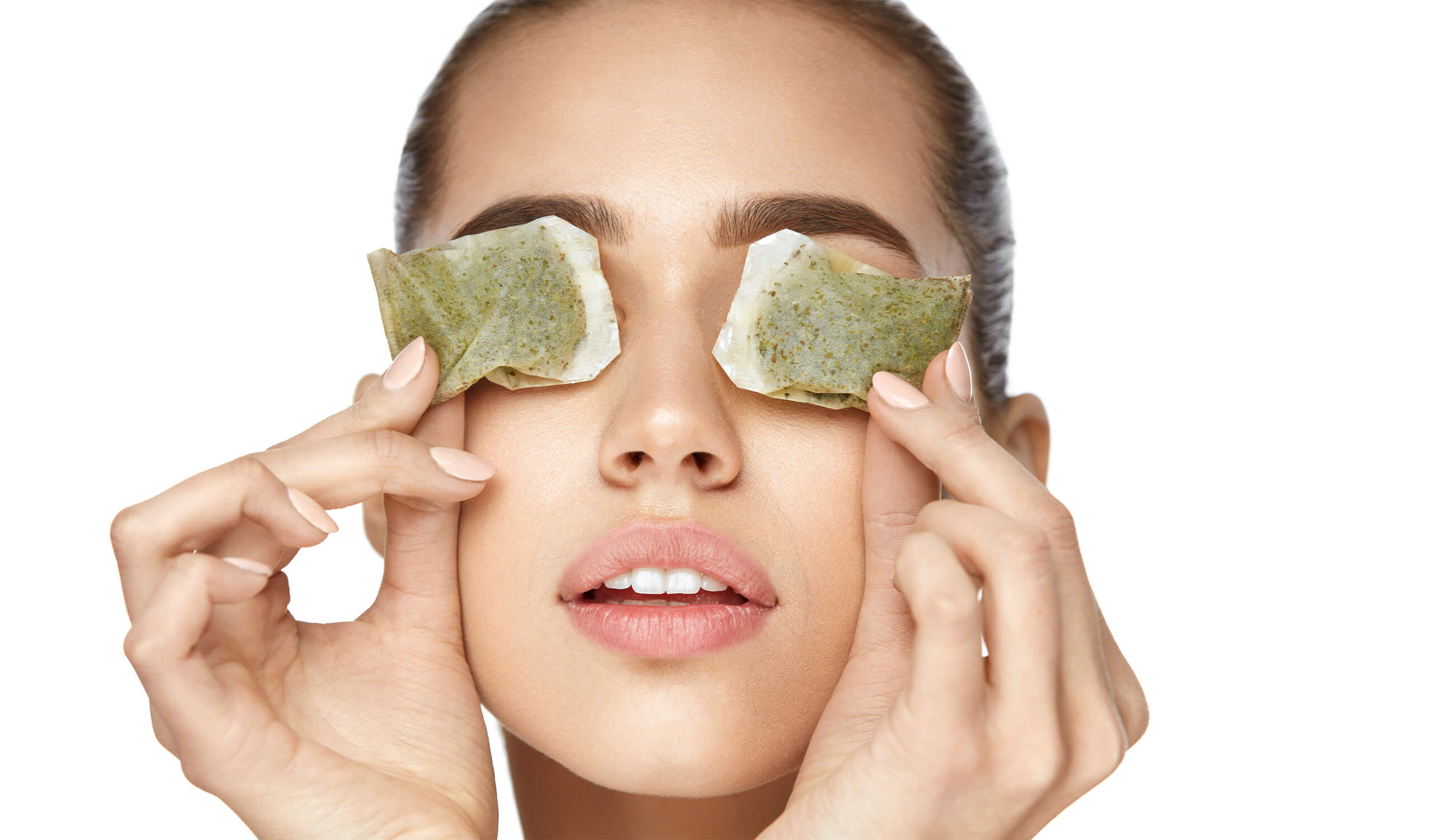 Woman With Green Tea Bag Under Eyes