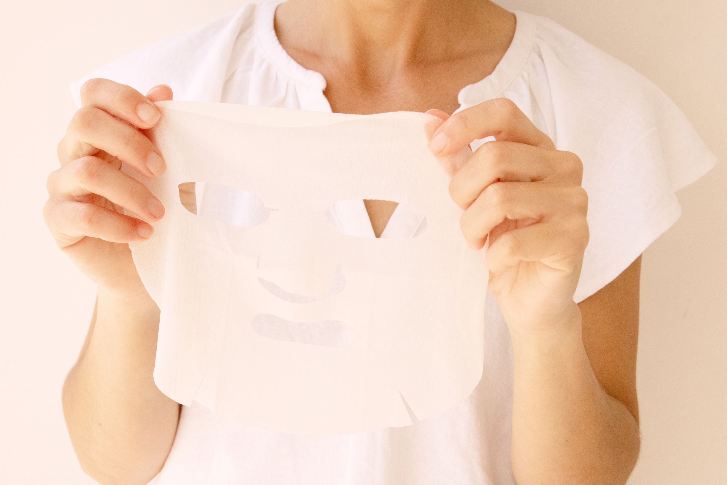 Woman_using_100_PURE_Does_it_All_sheet_mask