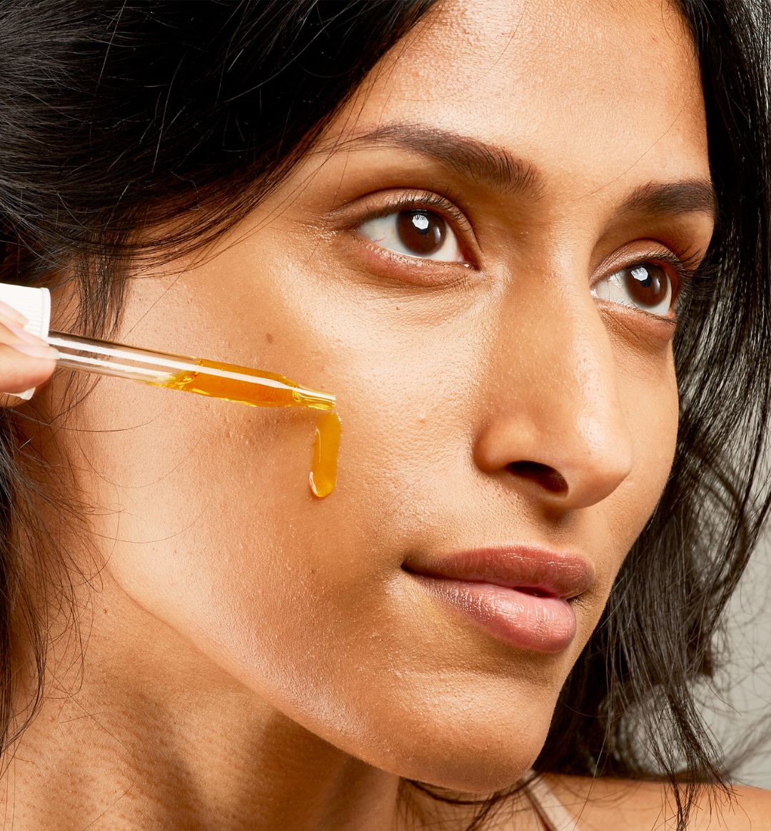 Woman_using_100_PURE_Vitamin_C_Serum