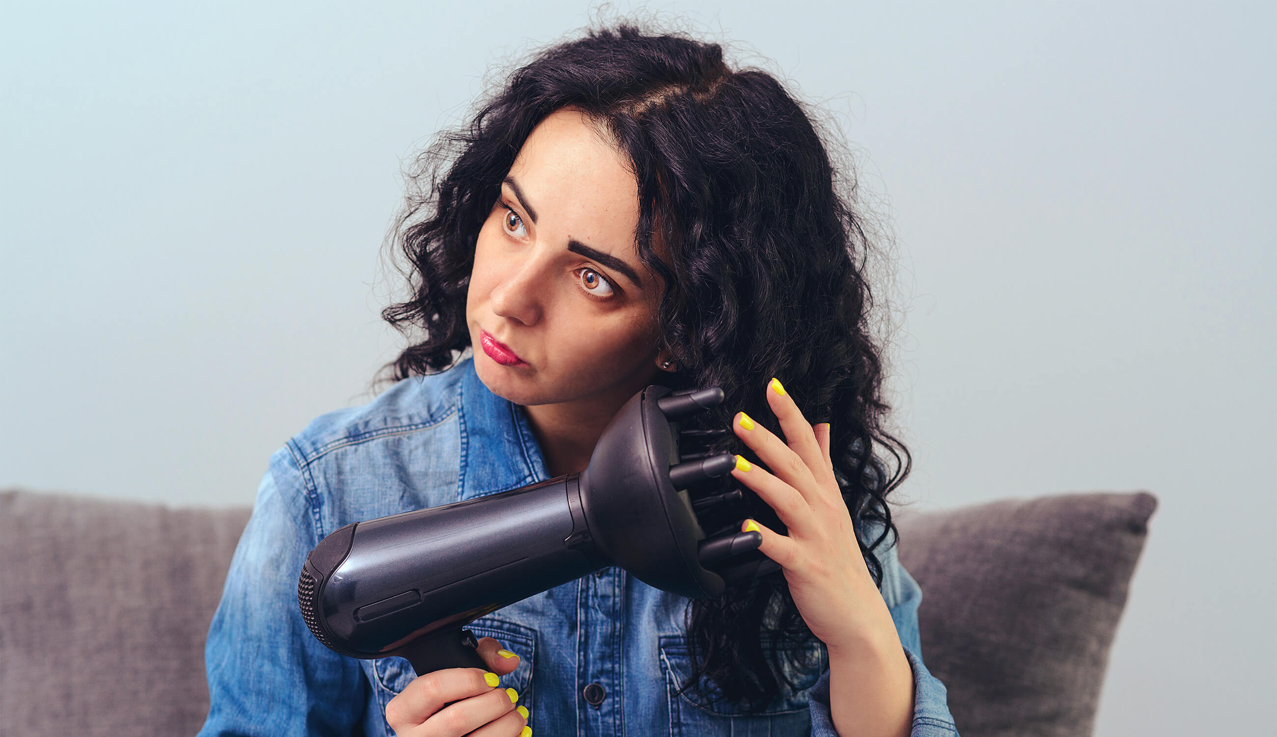 Girl diffusing curly hair.jpg