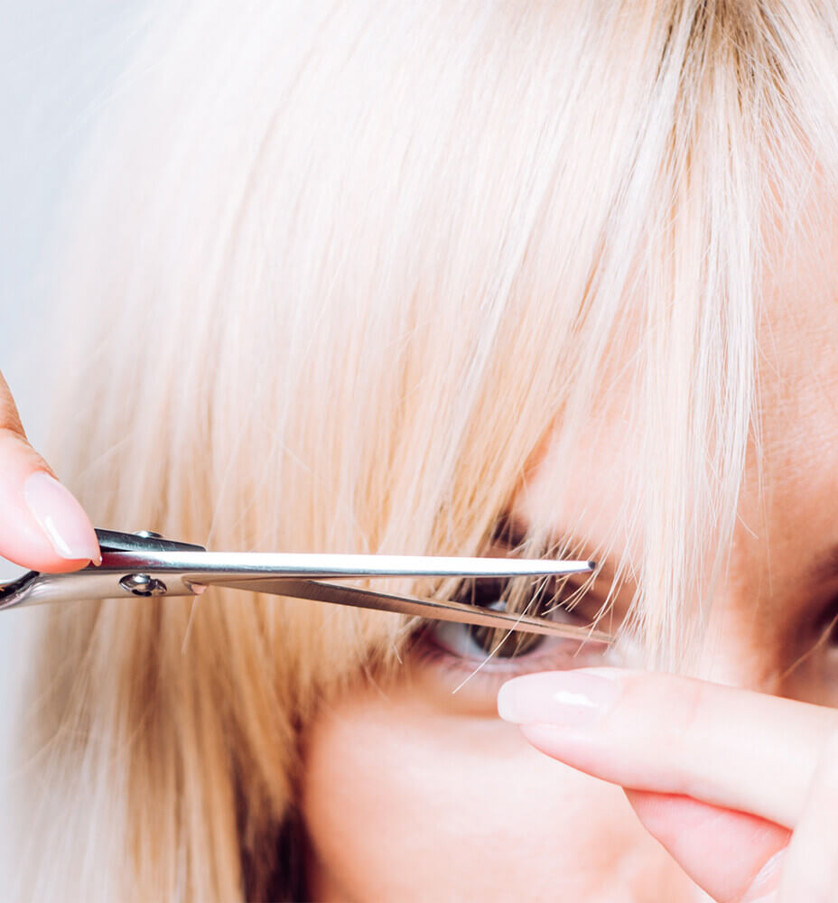 main_woman trimming bangs.jpg