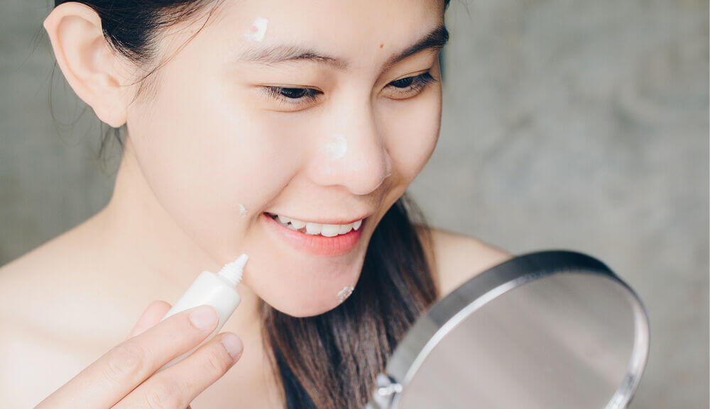 main_applying an acne spot treatment.jpg