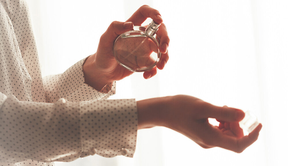 Main_applying perfume on her wrist.jpg