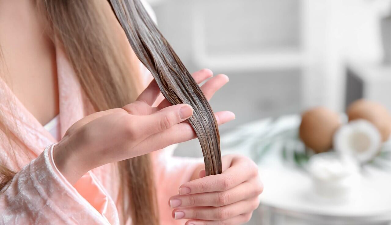 Main_woman applying hair mask.jpg