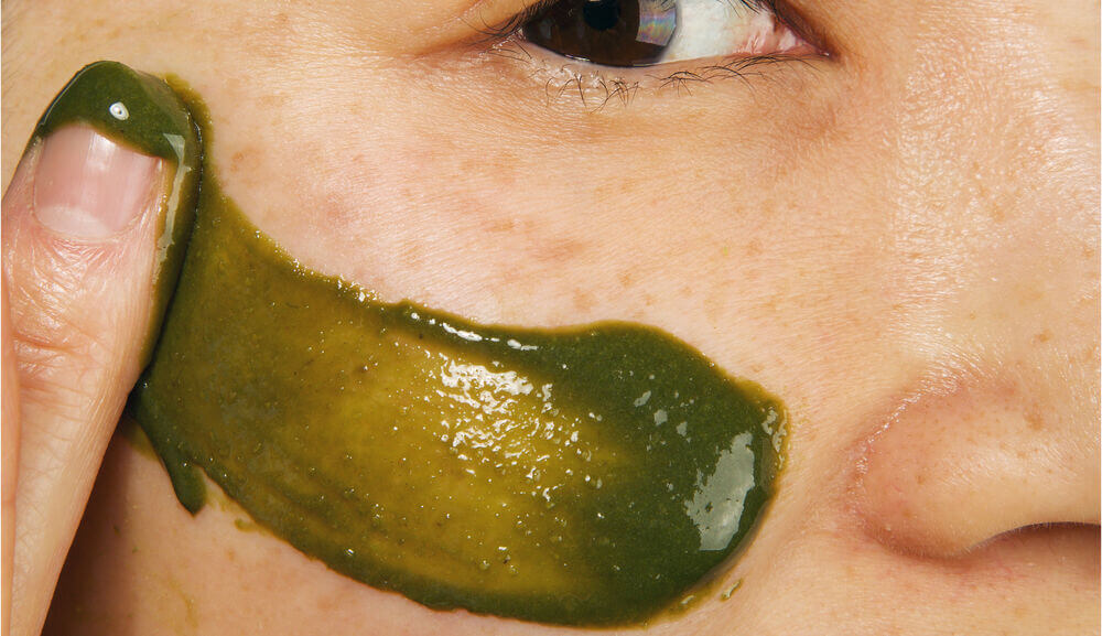 Matcha oat face scrub on skin.jpg