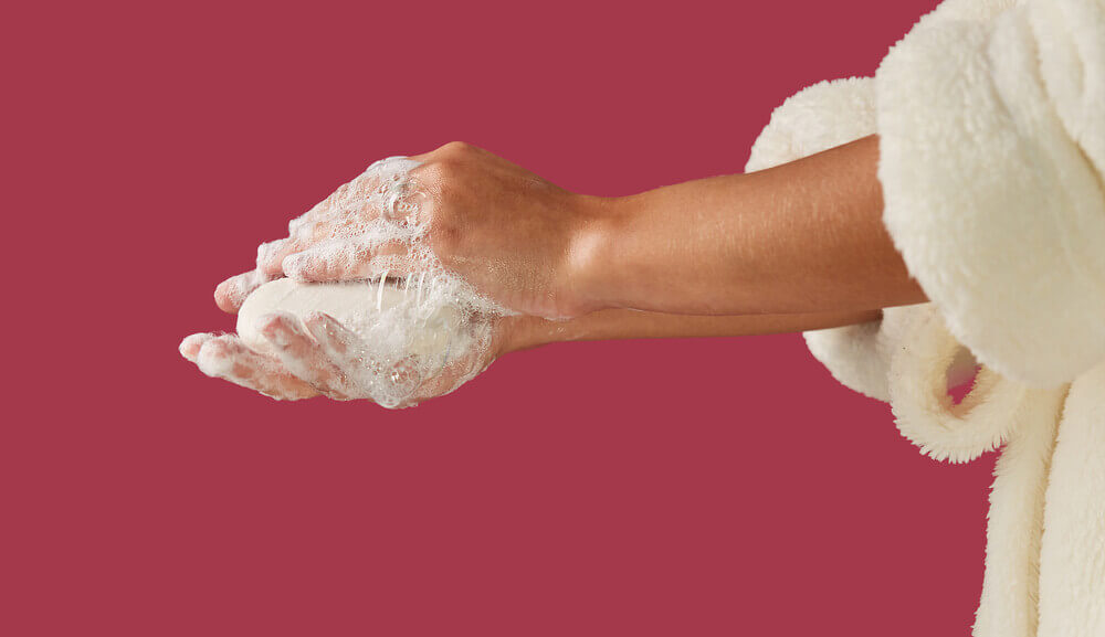 Woman washing with bar soap.jpg