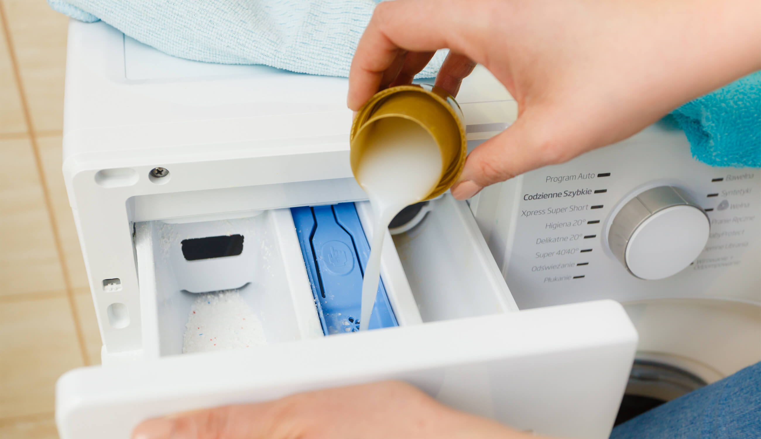 laundry detergent being poured into washing machine.jpg