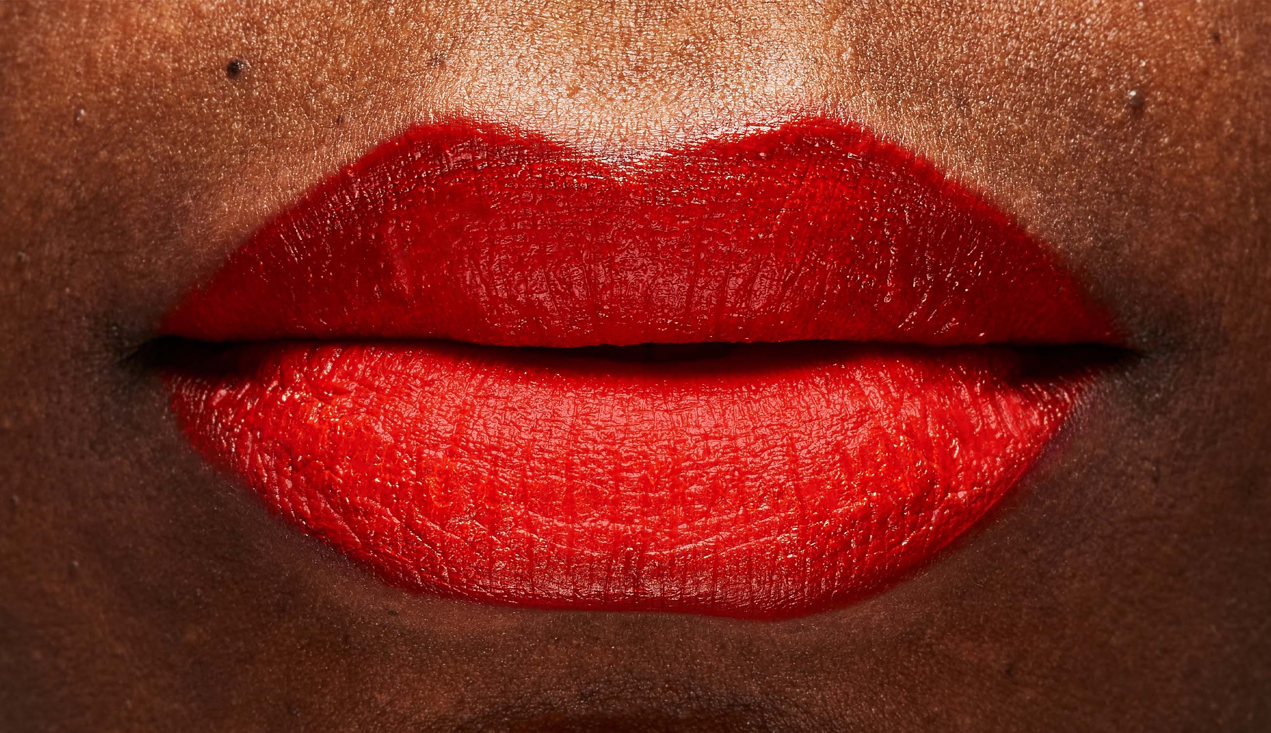 Lips wearing fruit pigmented lip glaze.jpg