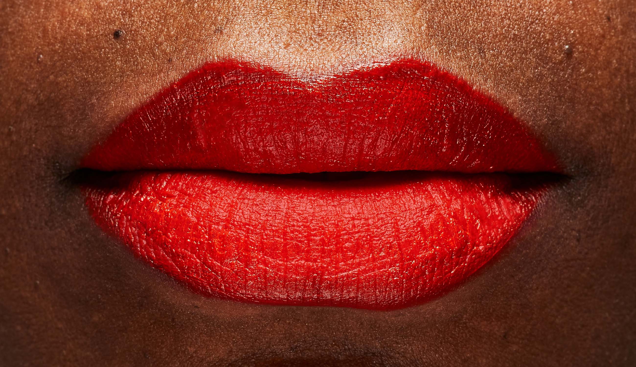 Lips wearing fruit pigmented lip glaze.jpg