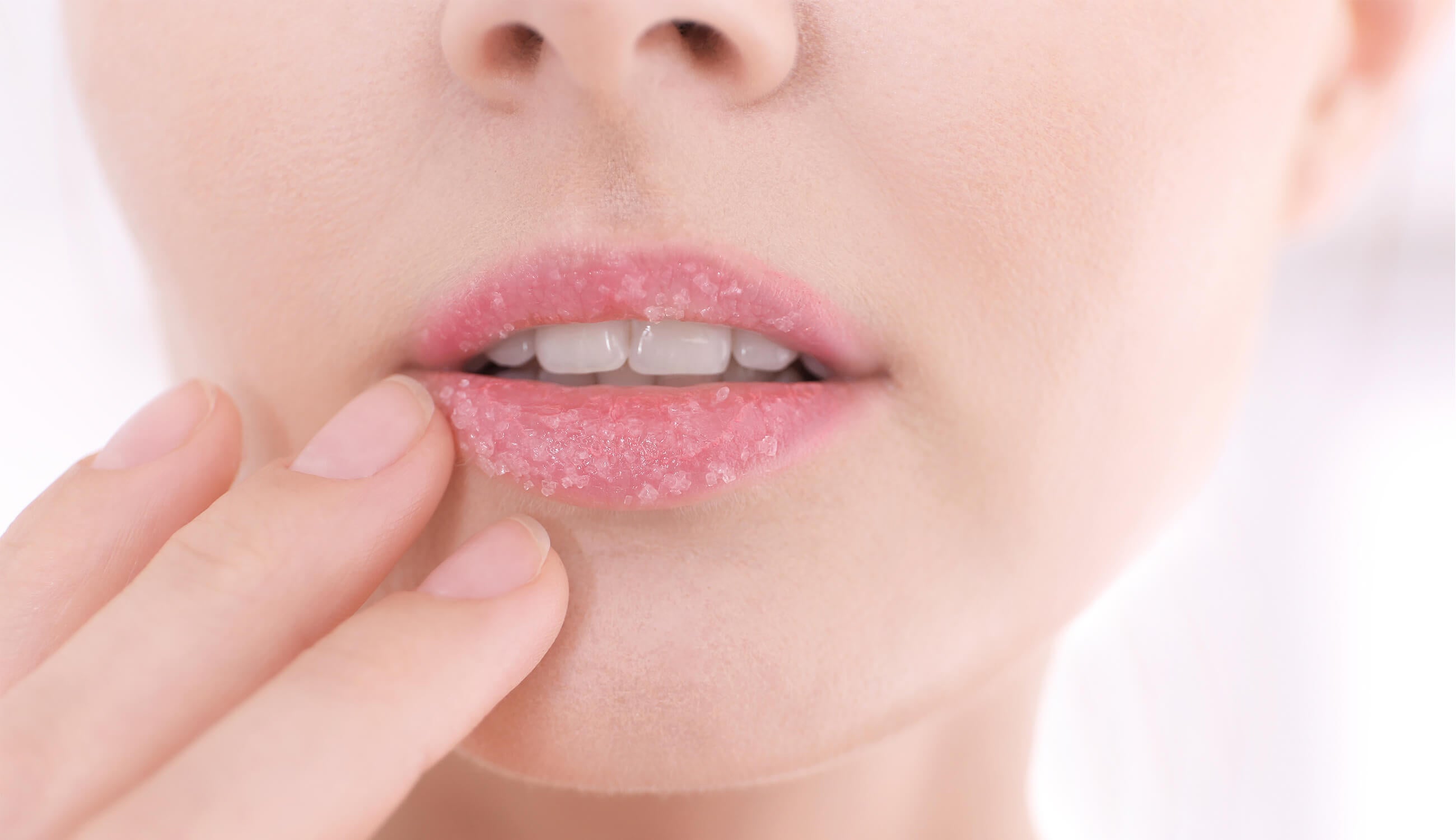 Closeup of lips covered in sugar scrub