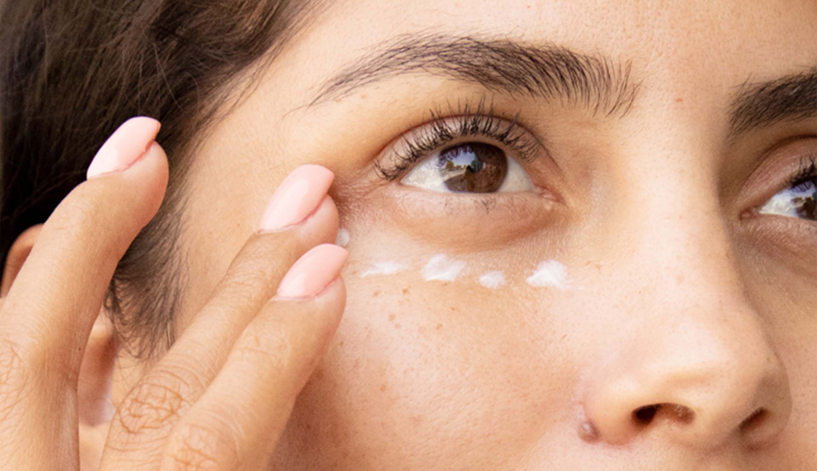 main_woman applying eye cream.jpg