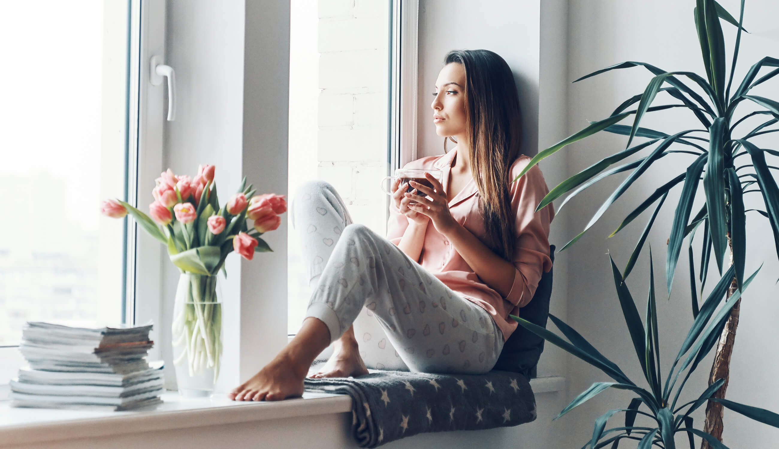 Main_woman in small private space looking contemplative.jpg