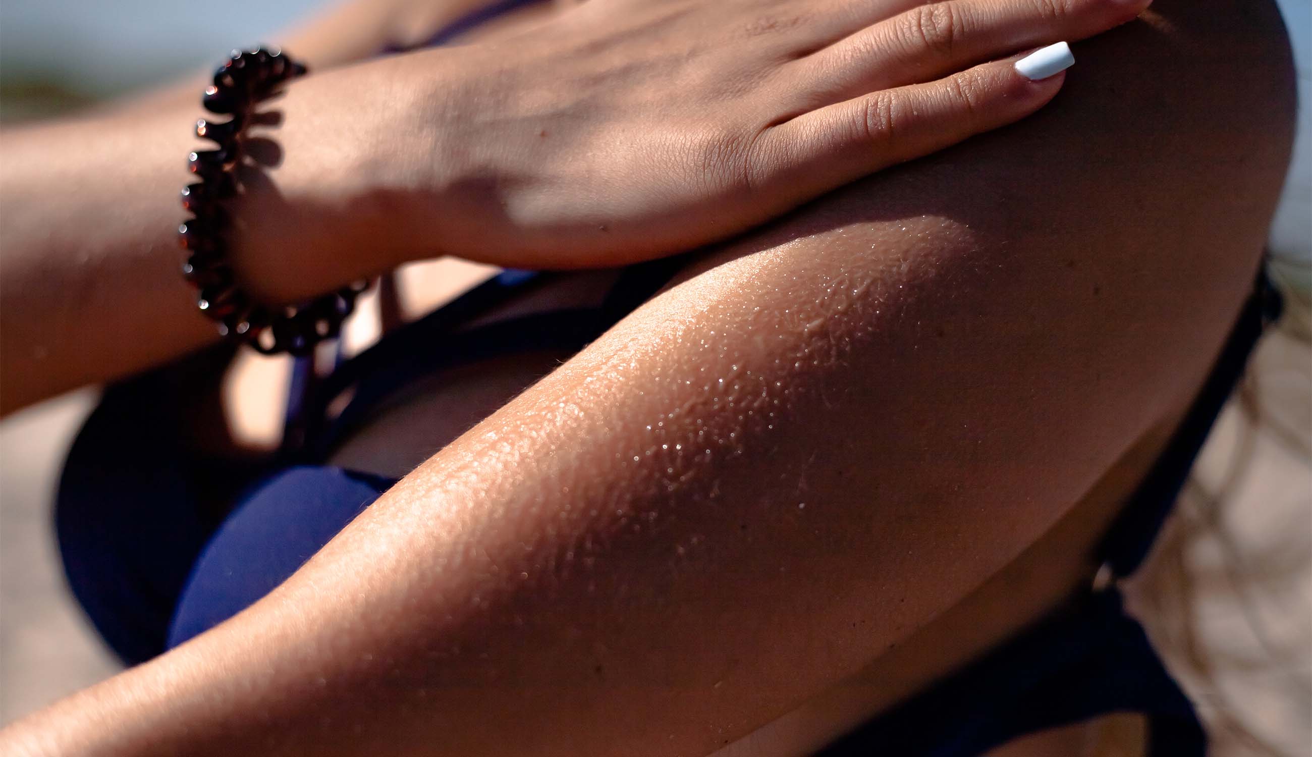 main_woman using tanning lotion.jpg