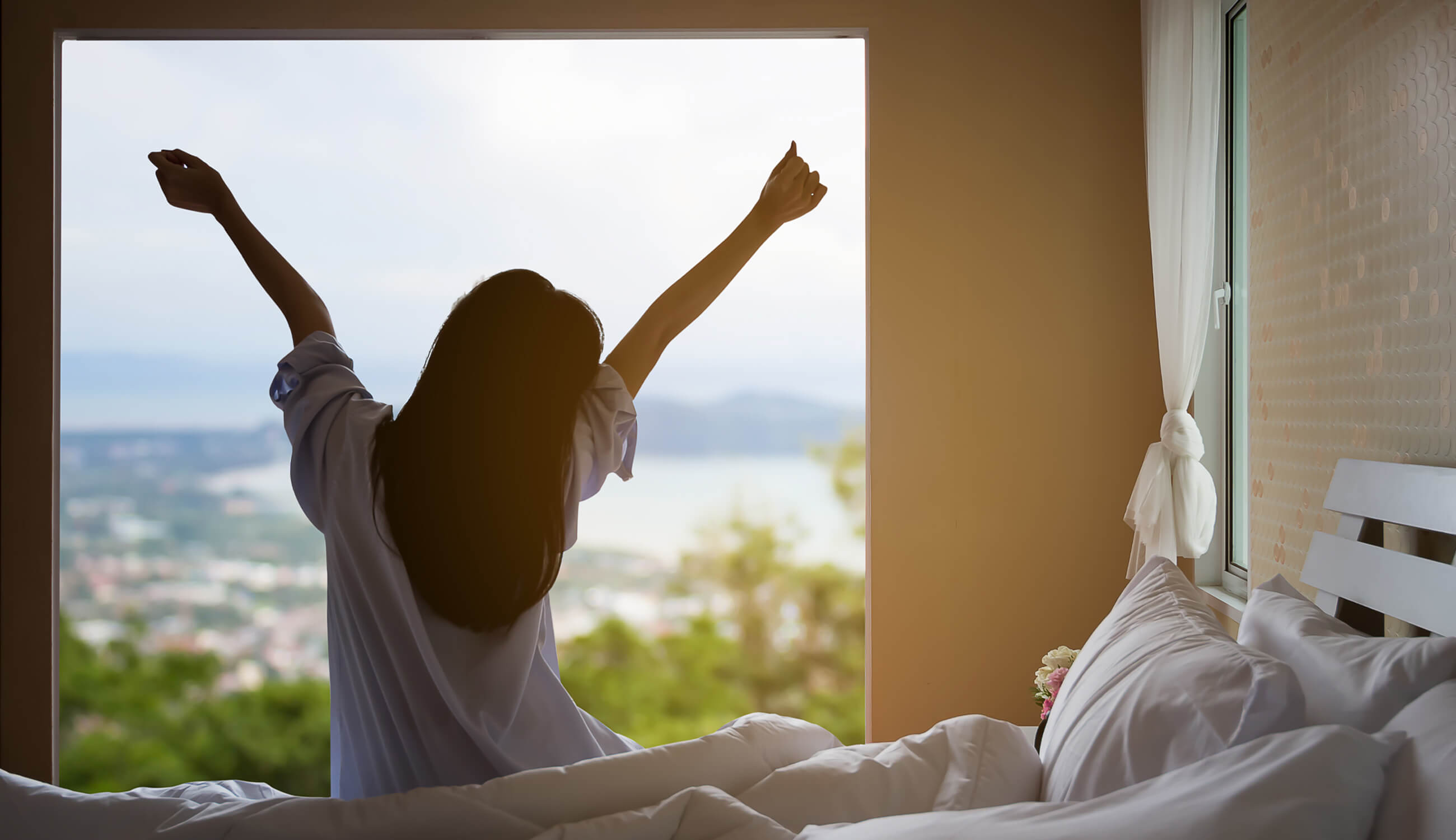 Woman waking up after safely using retinol