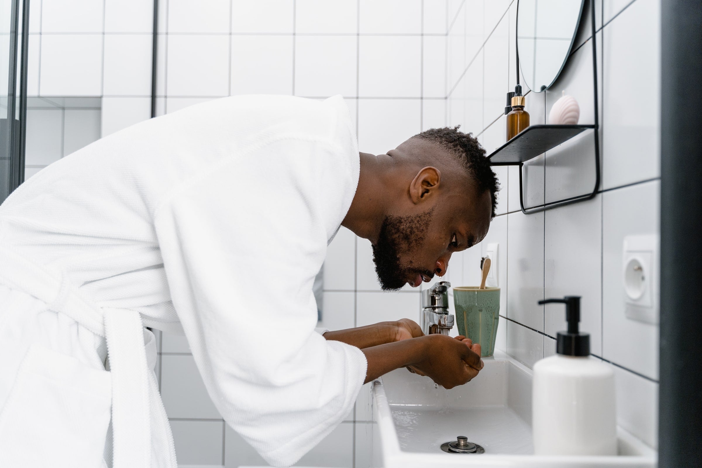 Man completing his natural skincare routine