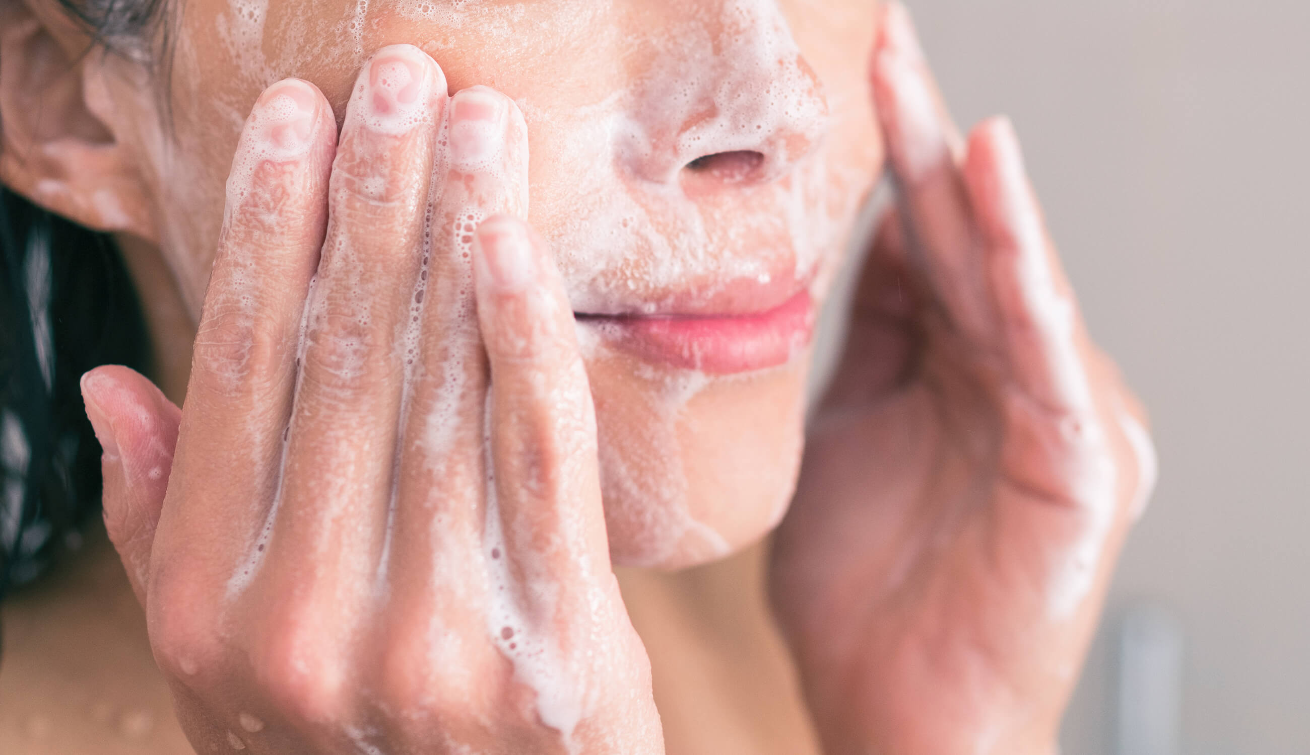 Scrubbing face with soap