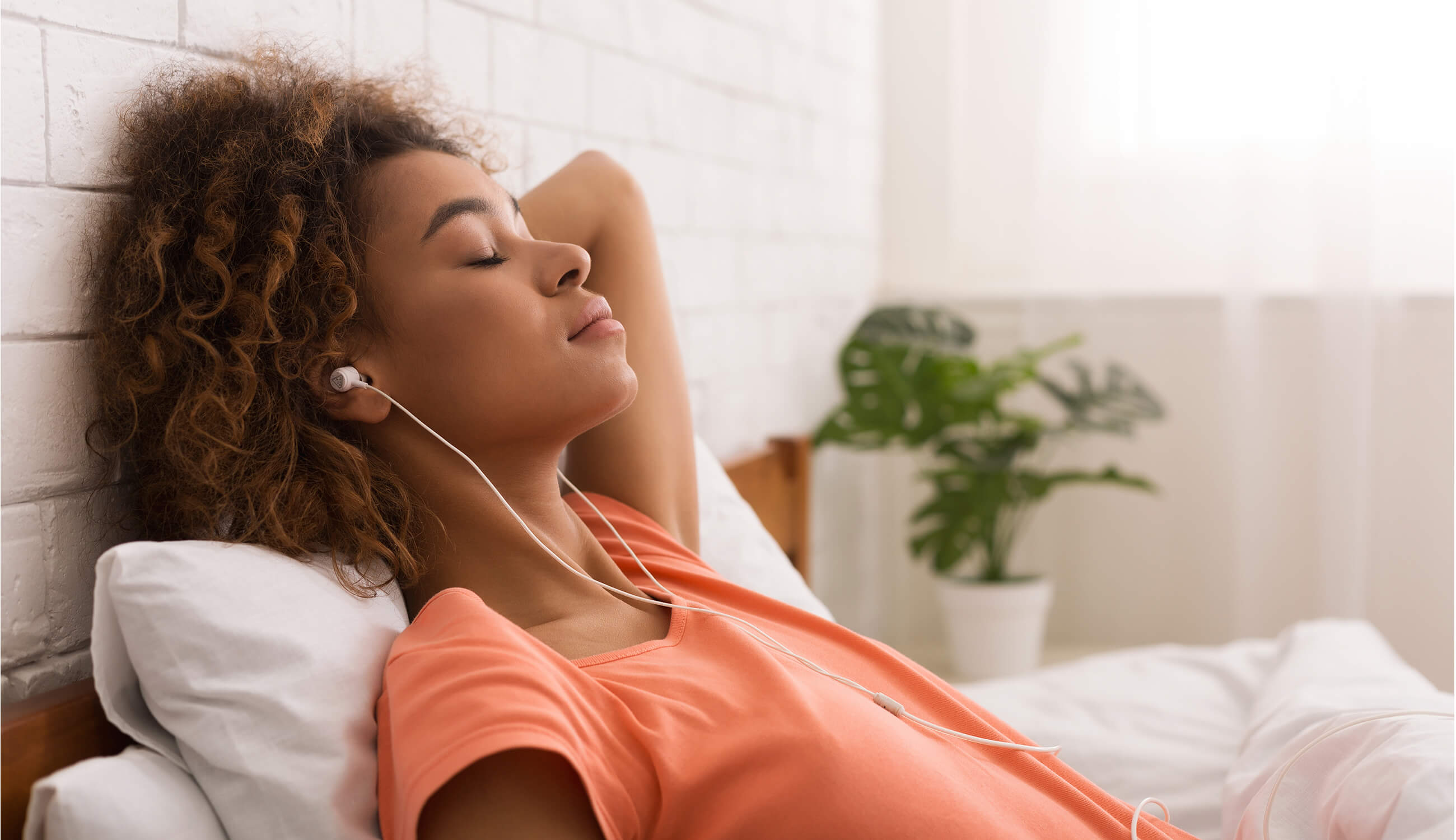 woman listening to earphones.jpg