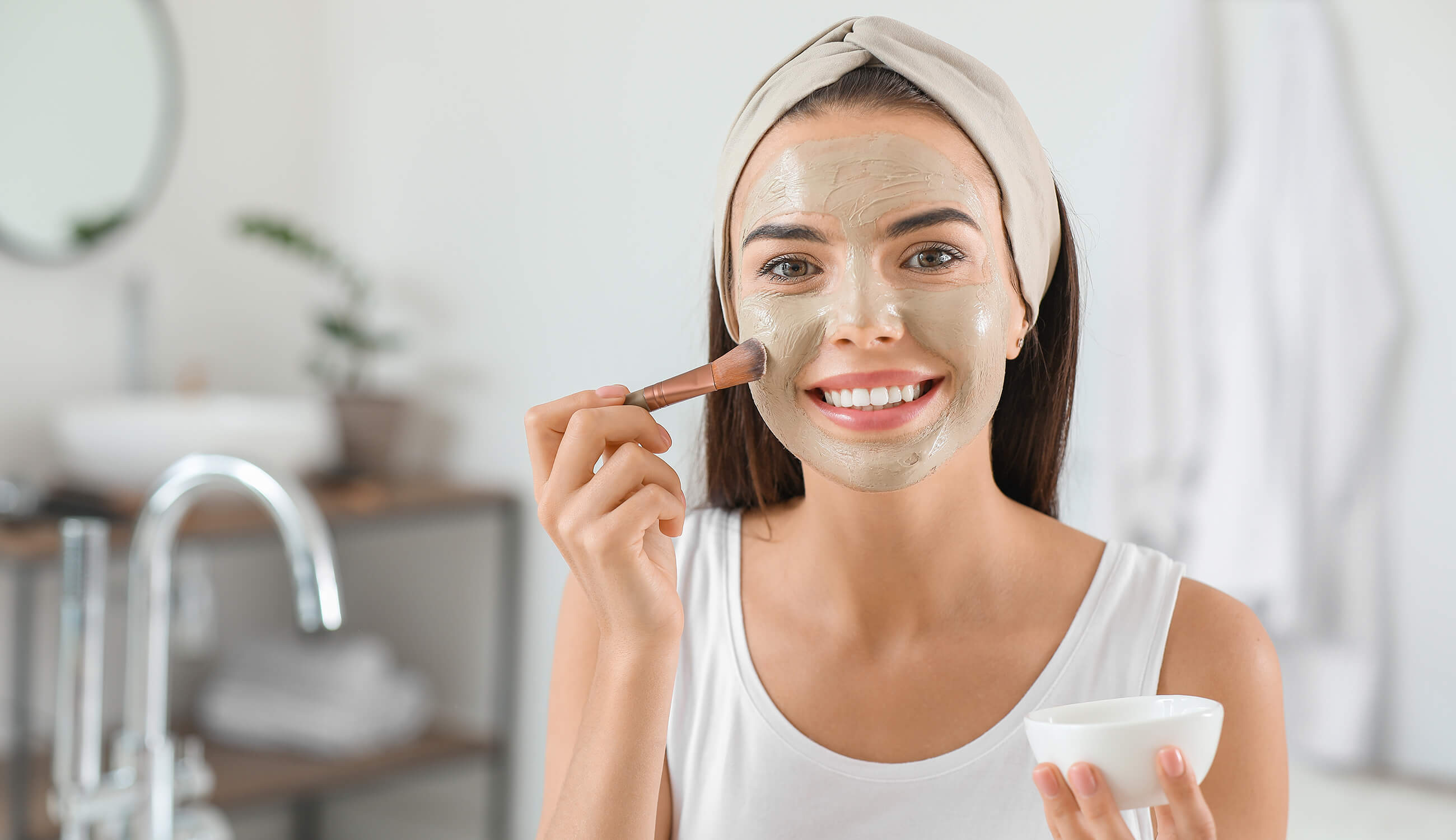 Woman performing facial.jpg