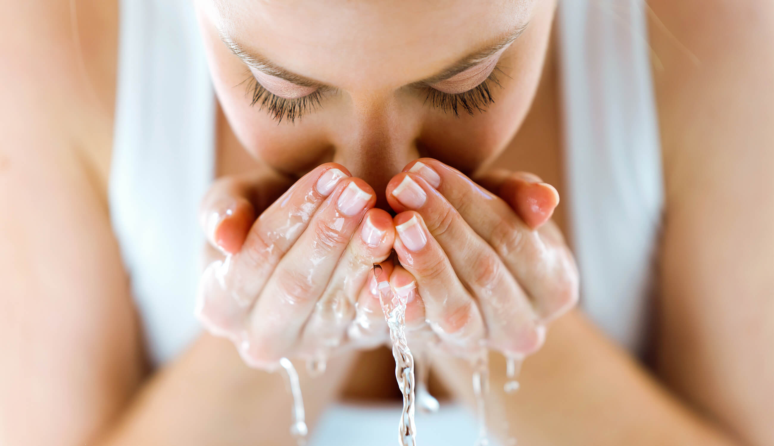 Woman washing face